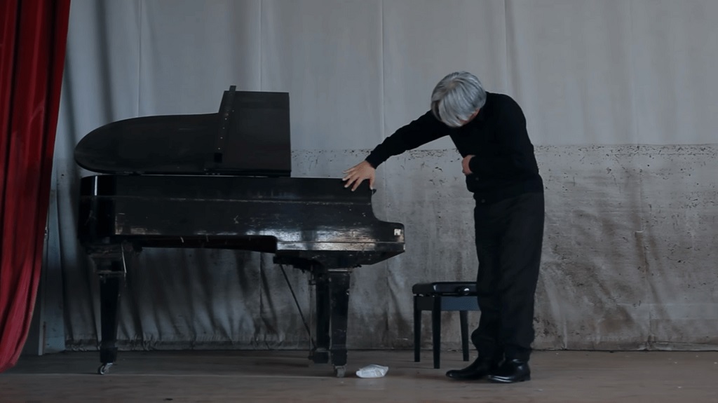 Ryuichi Sakamoto playing the tsunami piano